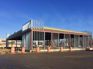 Metal studs used as the framing of a new small commercial building after Construction Layout Surveys